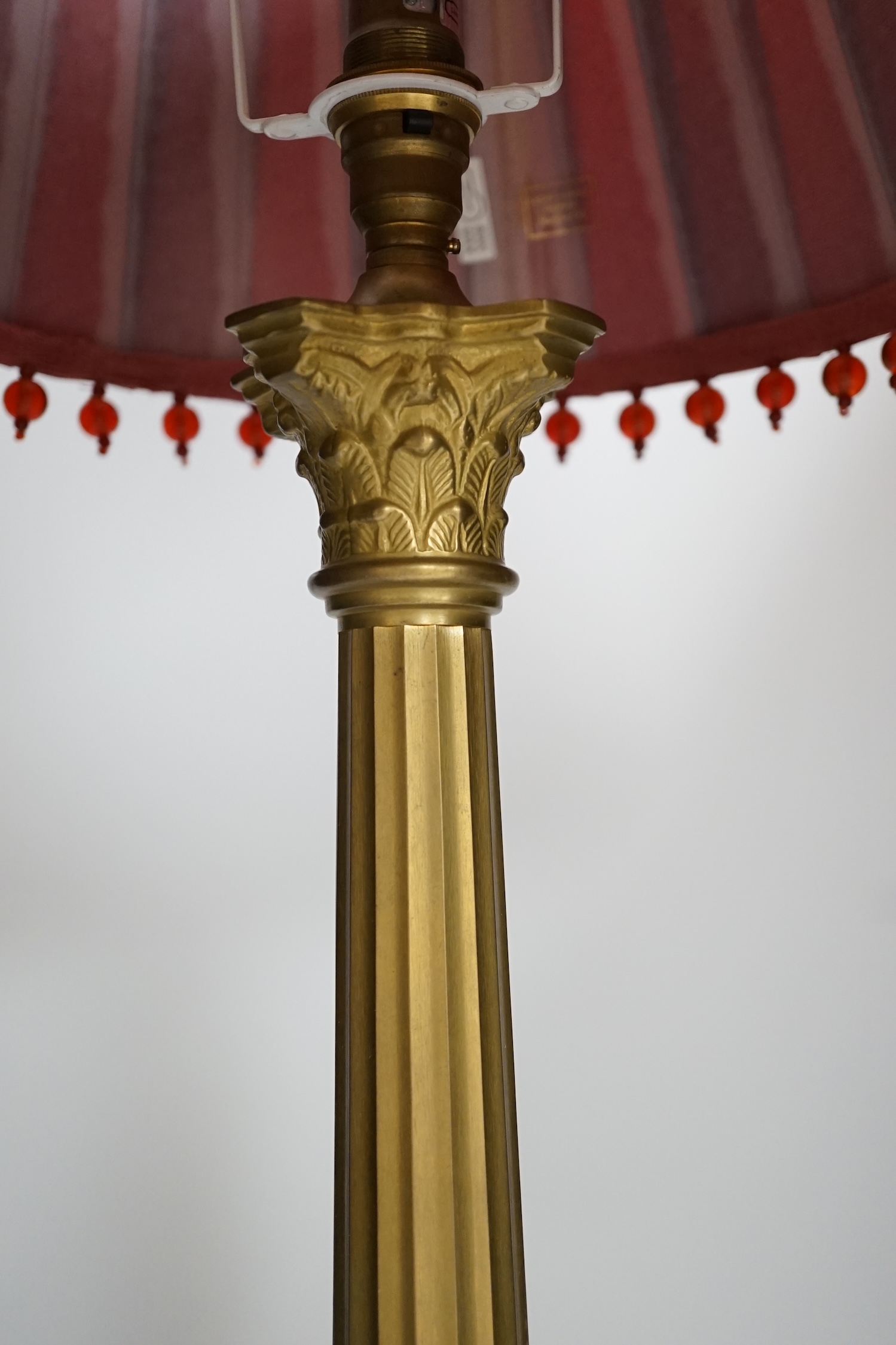 A brass column table lamp, 65cm high